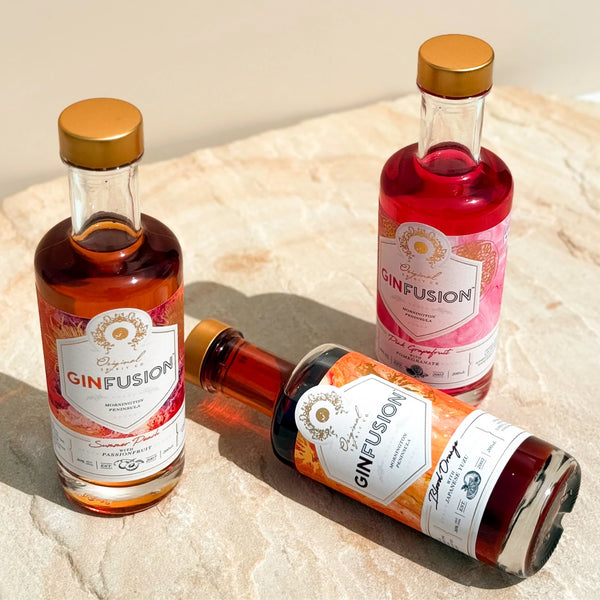 Mini 200ml bottles of GinFusion. 3 flavours - Blood Orange with Japanese Yuzu, Summer Peach with Passionfruit and Pink Grapefruit with Pomegranate.