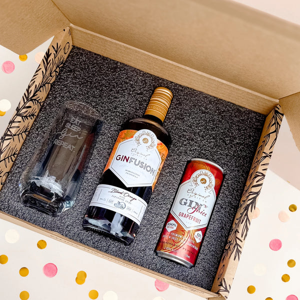 Original Spirit Co. Celebration Gift box, featuring a bottle of GinFusion, a can of Gin 'N' Juice, and an engraved tumbler "Eat. Sleep. Gin. Repeat", ideal for gifting.