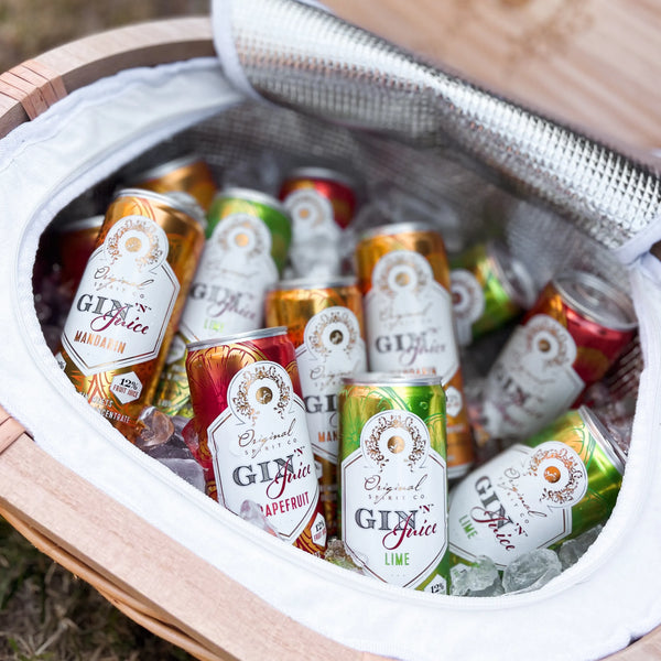 Assorted cans of Gin N Juice in a cooler with ice