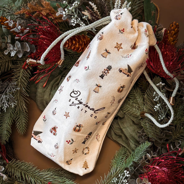 Original Spirit Co Christmas Gift Bag on green wreath