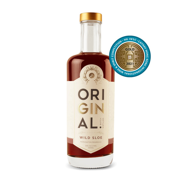 Bottle of Original Wild Sloe Gin with a white studio background and a Gold Medal from the Cathay Hong Kong International Wine & Spirit Competition