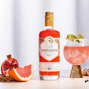 Ruby Grapefruit GinFusion pink gin served in a cocktail glass with ice and lime garnish