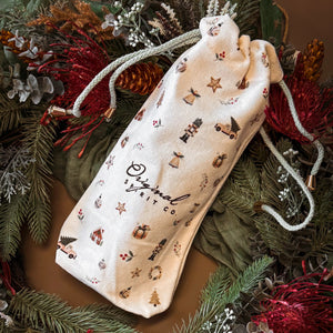 Original Spirit Co Christmas Gift Bag on green wreath