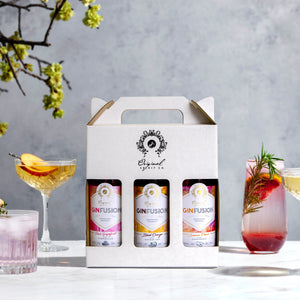 Gin Gift Box Set - Trio Pack of GinFusion. Shown with cocktails in background.